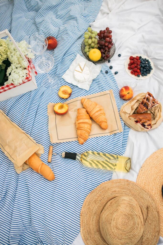 A charming picnic scene with fresh fruits, pastries, and a touch of elegance. Perfect outdoor dining experience.